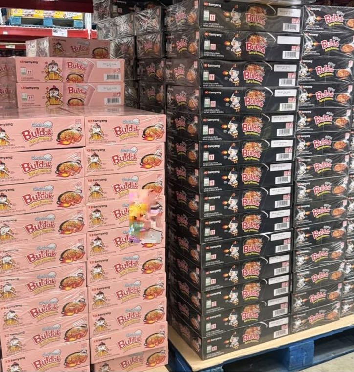 Cases of Samyang Buldak ramen stacked on pallets in the Amornphan Food warehouse