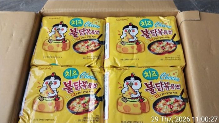 Samyang Buldak Cheese five-packs packed inside an open shipping carton